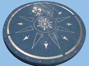 3 foot diameter compass rose cut from one piece of 2-3/4 inch thick bluestone and bronze. Designed by Frank Todd, Landscape Architect, Rowley, MA.
