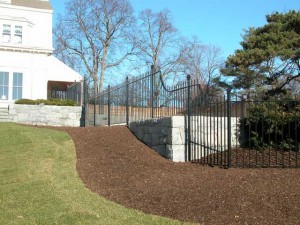 Wrought iron swimming pool fence enclosure at private residence designed by Hugh J. Collins Jr. Landscape Designer, Inc.