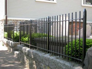 Small fence with forged historic finials found in the Marblehead and Salem Massachusetts area for a cemetery at St Michaels Church in Marblehead. 