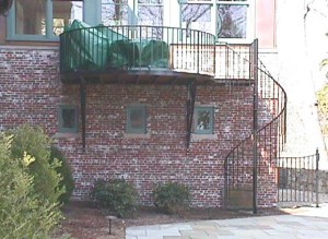 Wrought iron staircase, balcony and railings.