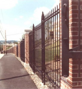 1100 feet of hand forged and color-galvanized perimeter security fence and seven sets of vehicular gates for the College of the Holy Cross, Worcester, MA, 1983.